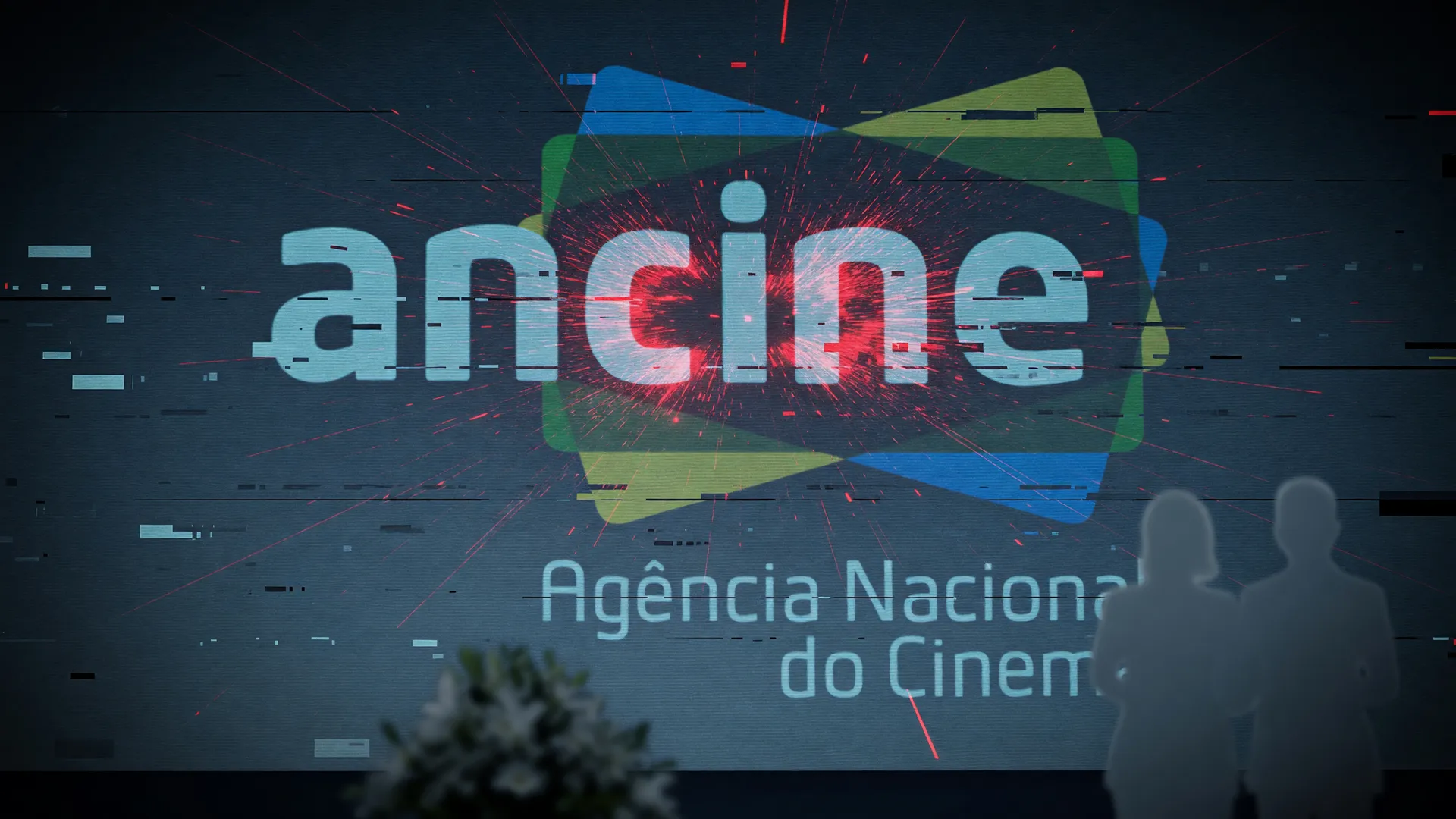 Logo da Ancine com efeito de falha digital representando o ataque hacker site da Ancine