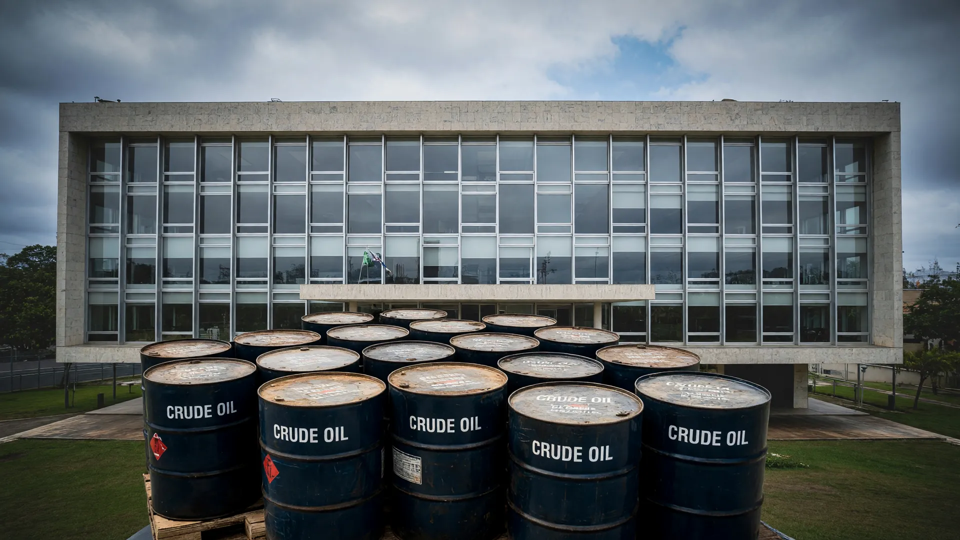 Prédio do STJ ao fundo com barris de petróleo em destaque, simbolizando o julgamento do fracking no STJ